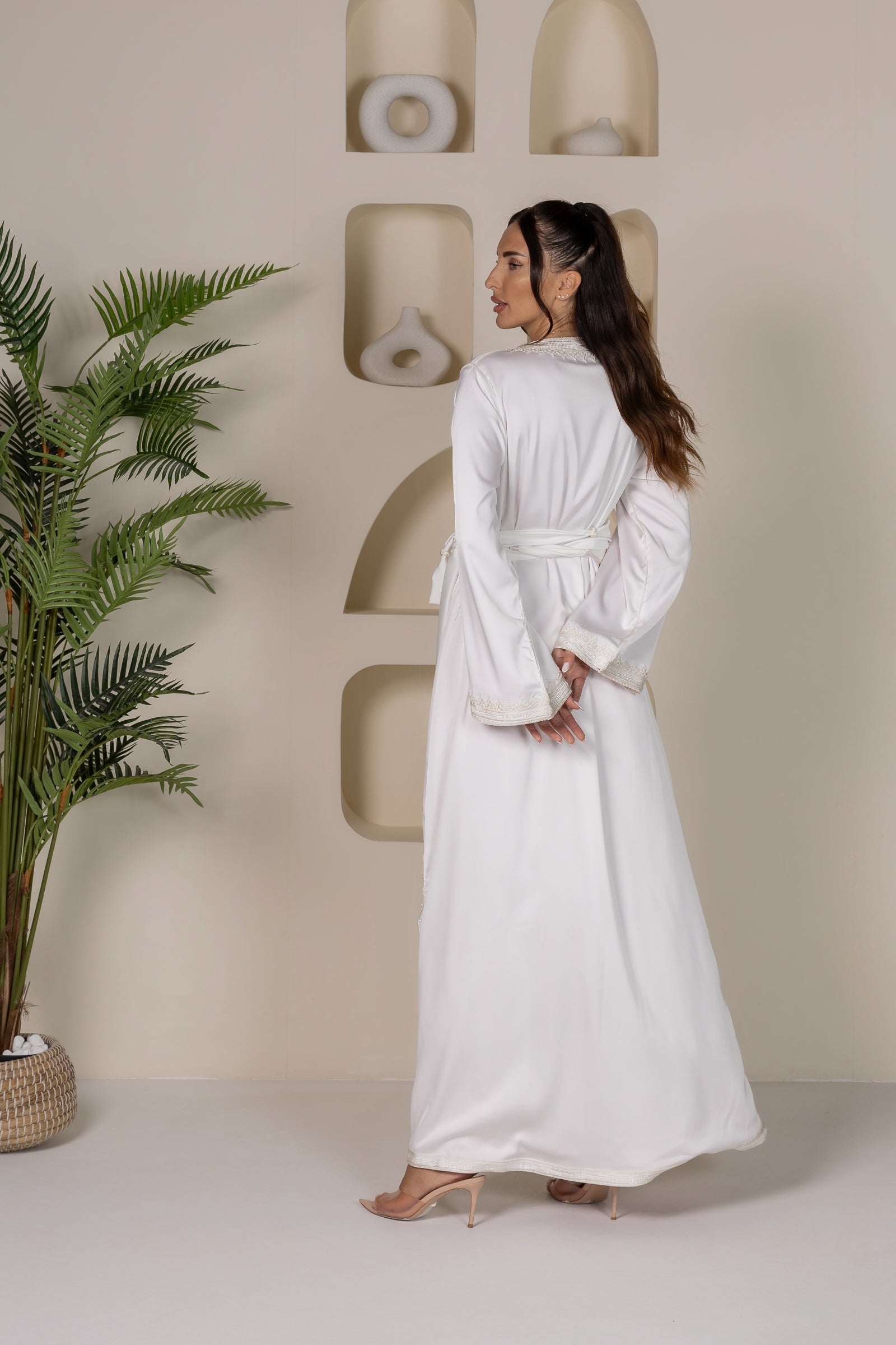 Back view of a white Moroccan kaftan showing the flowy silhouette